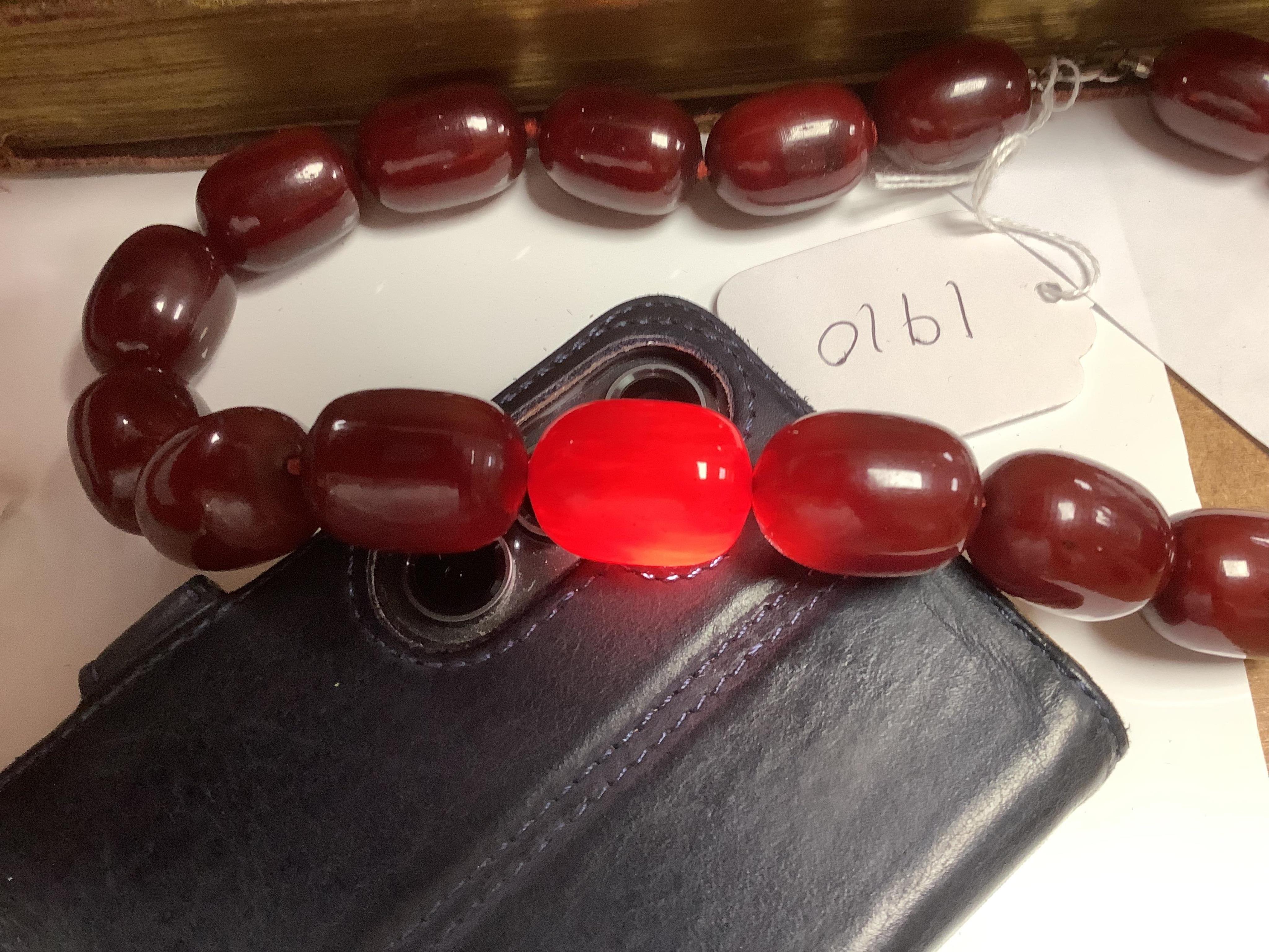 A single strand simulated cherry amber oval bead necklace, 48cm, gross weight 120 grams. Condition - fair